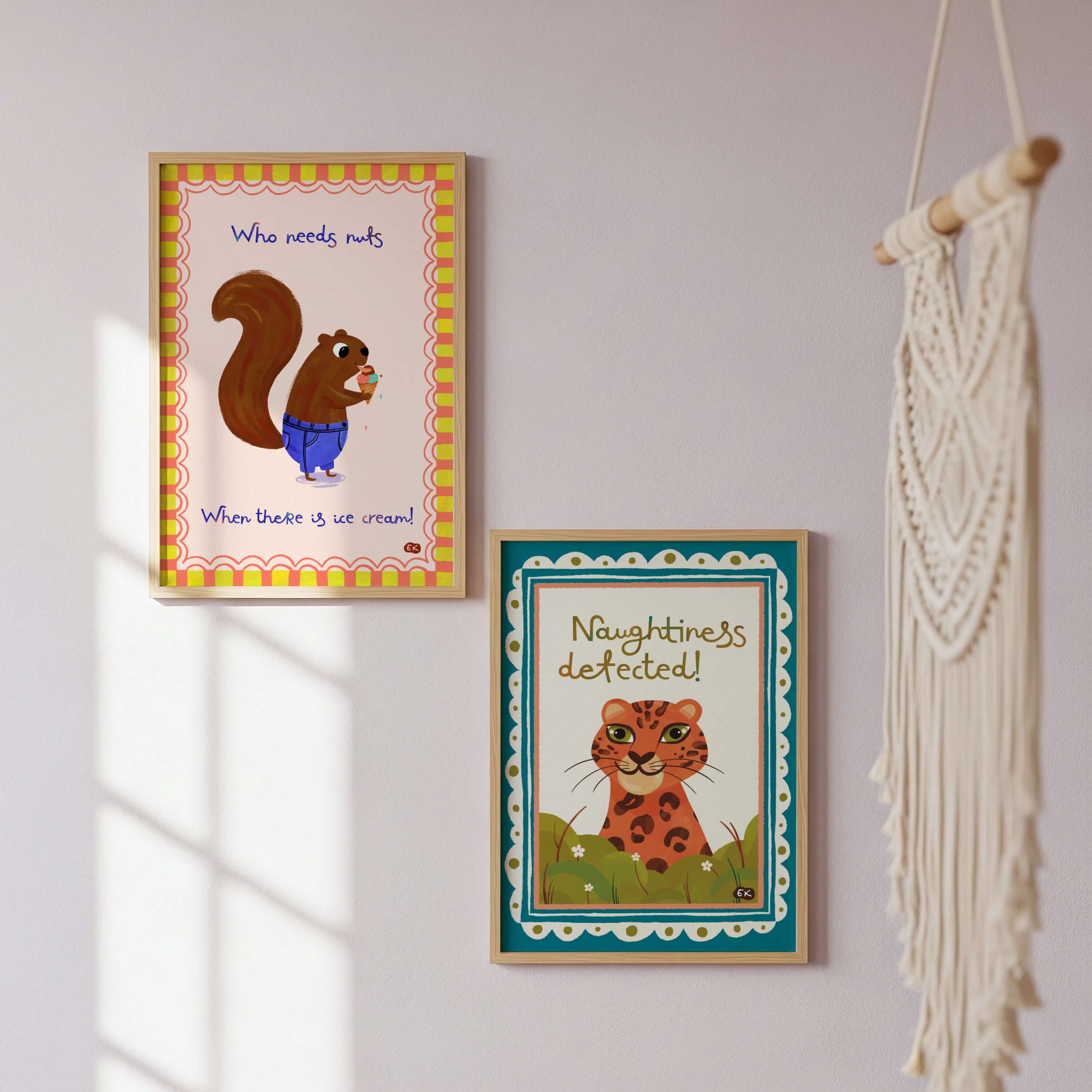 Two framed animal-themed prints on a wall.
