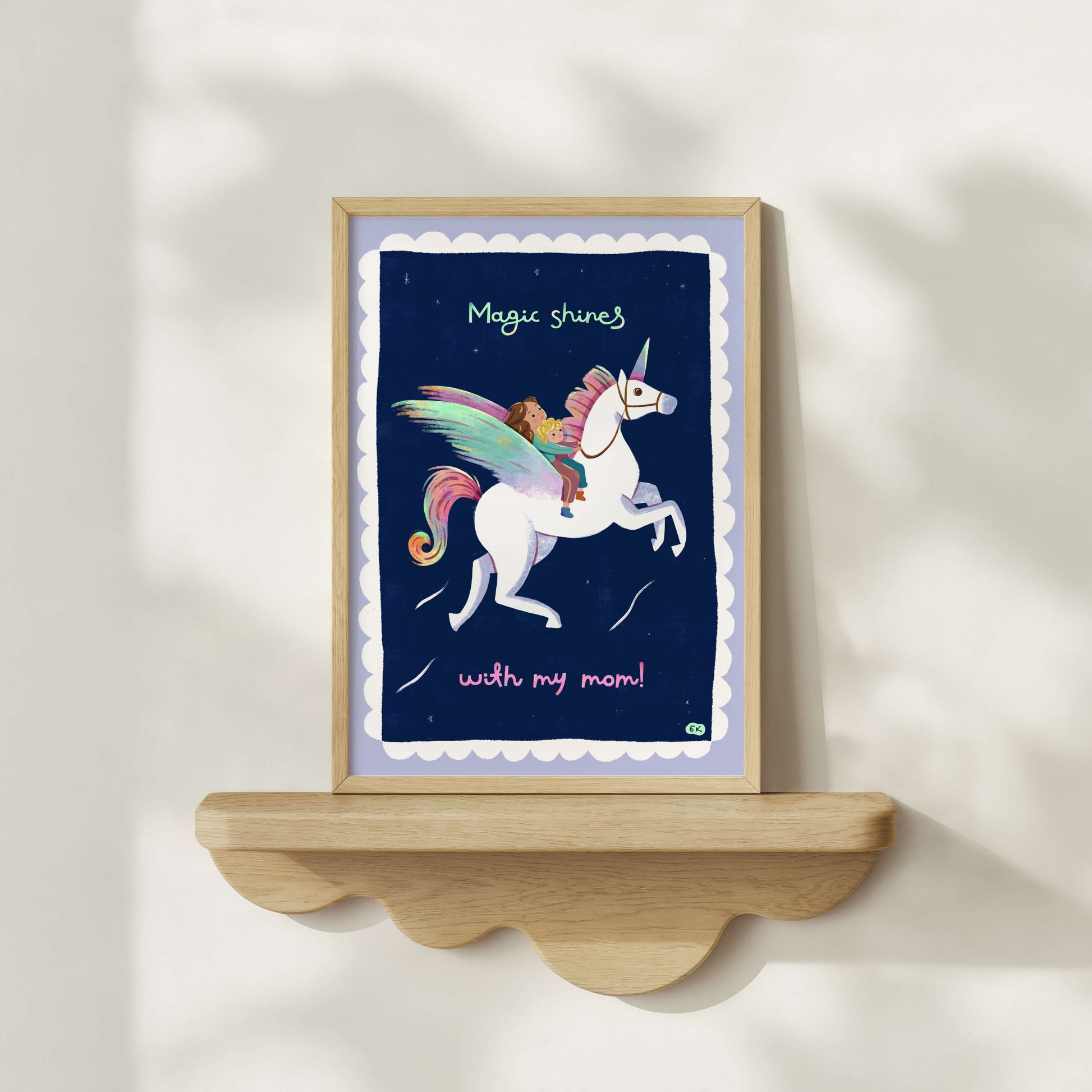 Hand-drawn framed artwork with a unicorn and child illustration on a shelf against a white wall.