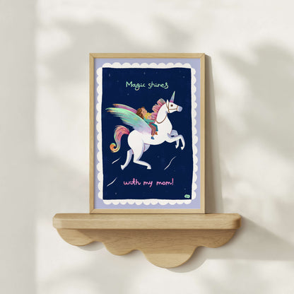 Hand-drawn framed artwork with a unicorn and child illustration on a shelf against a white wall.